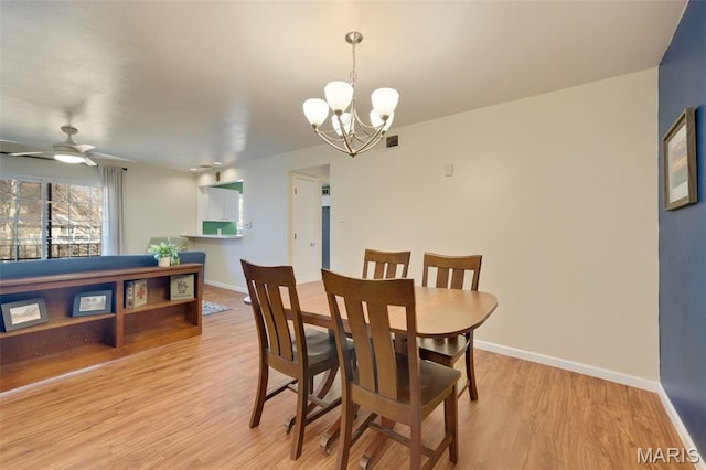 13485 Coliseum Dr Unit G, Chesterfield, MO 63017 - dining room with a chandelier, light wood-type flooring, baseboards, and ceiling fan