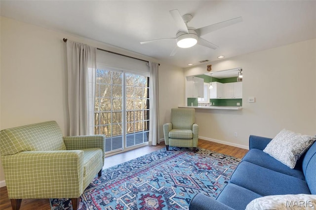 13485 Coliseum Dr Unit G, Chesterfield, MO 63017 - living room with wood finished floors, a ceiling fan, baseboards, and recessed lighting