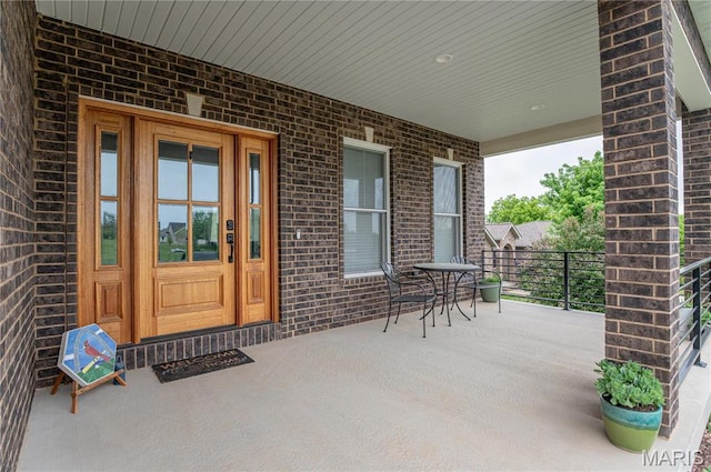 1201 Aster Ct, St James, MO 65559 - view of exterior entry with brick siding and a porch
