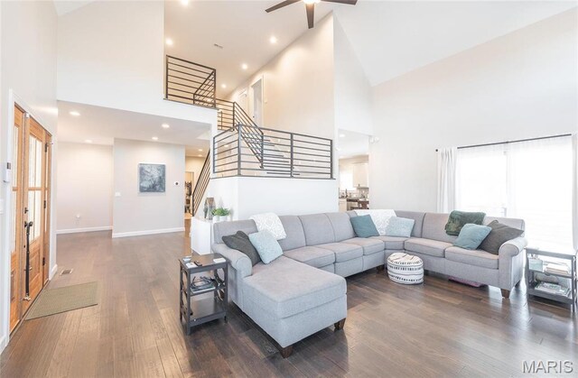 1201 Aster Ct, St James, MO 65559 - living area with high vaulted ceiling, stairway, dark wood-style flooring, ceiling fan, and baseboards