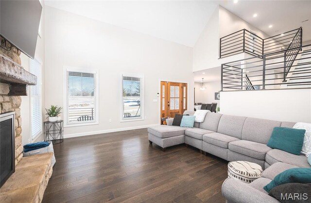 1201 Aster Ct, St James, MO 65559 - living area with high vaulted ceiling, dark wood-style flooring, a fireplace, baseboards, and recessed lighting