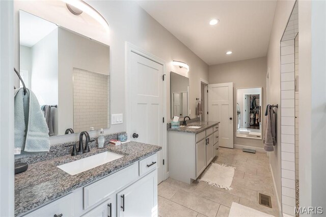 1201 Aster Ct, St James, MO 65559 - bathroom featuring two vanities, recessed lighting, tile patterned floors, and a spacious closet