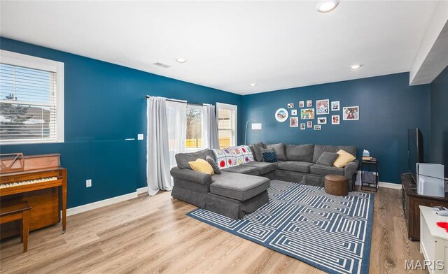 1201 Aster Ct, St James, MO 65559 - living area featuring wood finished floors, baseboards, and recessed lighting
