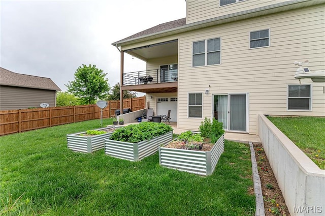 1201 Aster Ct, St James, MO 65559 - rear view of house with a vegetable garden and a balcony