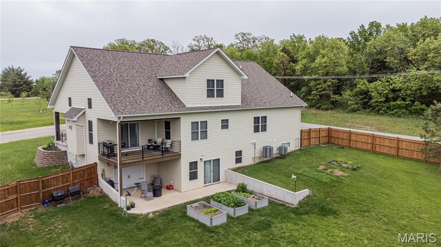 1201 Aster Ct, St James, MO 65559 - rear view of house featuring a patio, roof with shingles, a balcony, a vegetable garden, and cooling unit