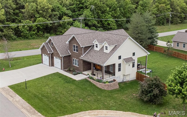 1201 Aster Ct, St James, MO 65559 - view of front of house featuring covered porch, a garage, concrete driveway, and a shingled roof