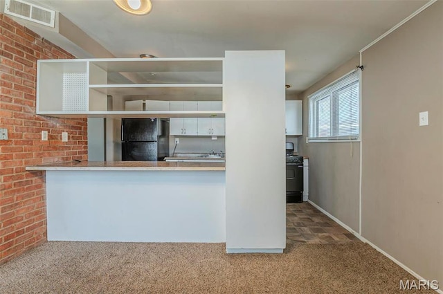 5 Little Ln, Florissant, MO 63033 - kitchen with freestanding refrigerator, range with gas cooktop, carpet, and open shelves