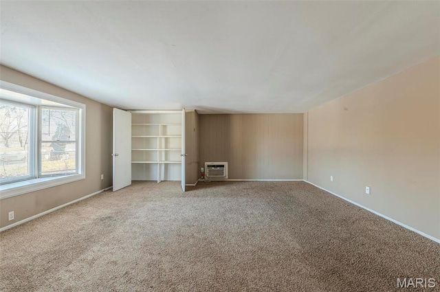 5 Little Ln, Florissant, MO 63033 - unfurnished living room with carpet floors and baseboards