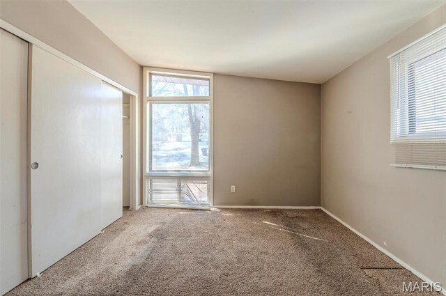 5 Little Ln, Florissant, MO 63033 - carpeted spare room with plenty of natural light and baseboards
