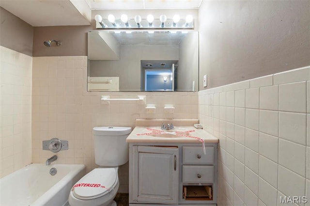5 Little Ln, Florissant, MO 63033 - bathroom featuring tile walls, toilet, vanity, and bathtub / shower combination