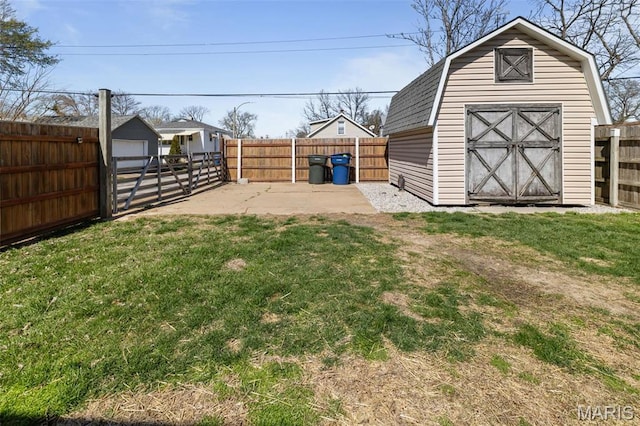 5839 W Park Ave, Saint Louis, MO 63110 - view of yard featuring an outdoor structure, a storage unit, and a patio area