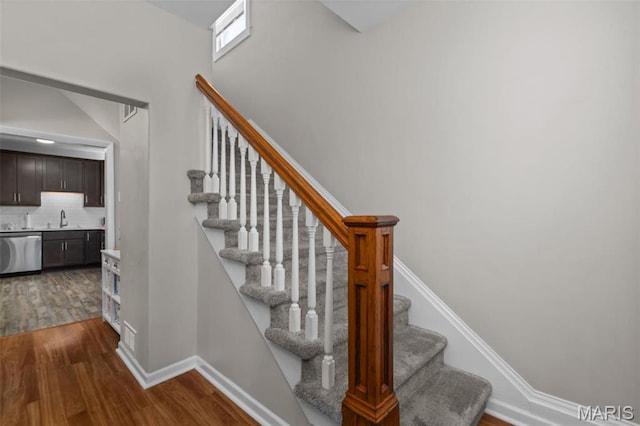 5839 W Park Ave, Saint Louis, MO 63110 - stairway featuring wood finished floors and baseboards