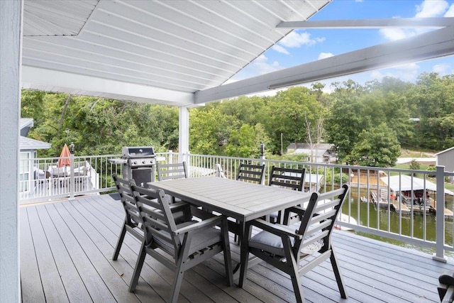 29420 Park Ave, Gravois Mills, MO 65037 - deck with area for grilling, outdoor dining area, a water view, and view of scattered trees