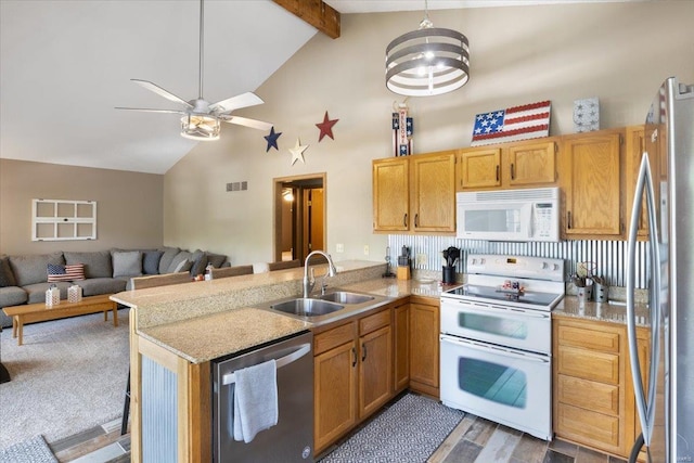 29420 Park Ave, Gravois Mills, MO 65037 - kitchen featuring appliances with stainless steel finishes, a sink, a peninsula, high vaulted ceiling, and open floor plan