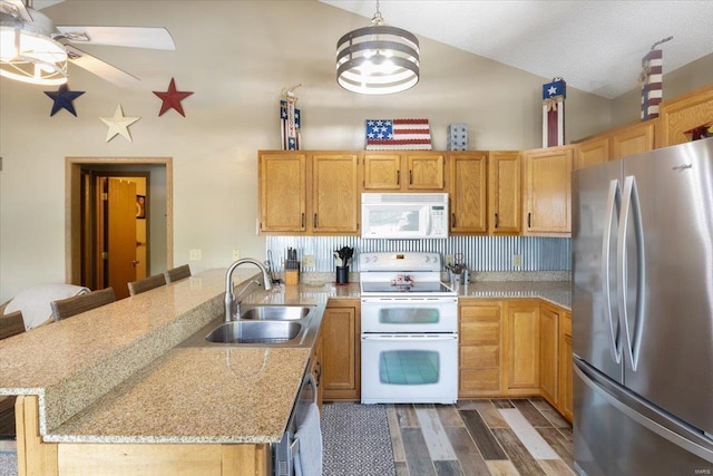29420 Park Ave, Gravois Mills, MO 65037 - kitchen with stainless steel appliances, a peninsula, a sink, wood finished floors, and ceiling fan