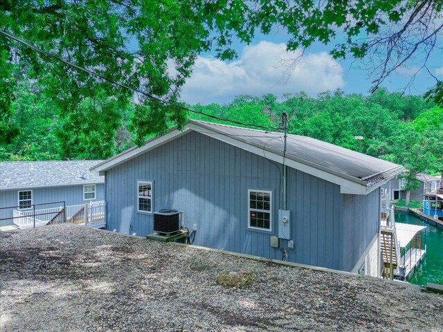29420 Park Ave, Gravois Mills, MO 65037 - view of property exterior featuring central AC unit and fence
