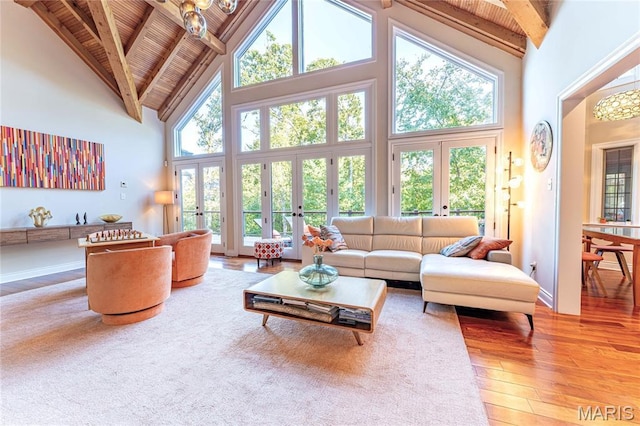 16 Holiday Ln, Saint Louis, MO 63131 - living area with french doors, wood ceiling with exposed beams, high vaulted ceiling, wood-type flooring, and healthy amount of natural light
