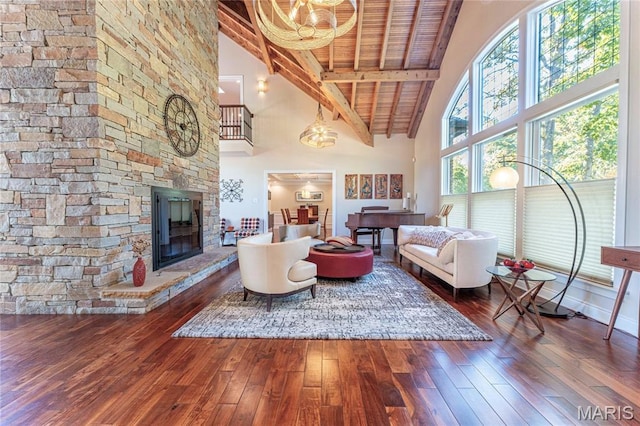 16 Holiday Ln, Saint Louis, MO 63131 - living area featuring high vaulted ceiling, hardwood / wood-style flooring, wooden ceiling with exposed beams, a chandelier, and a fireplace