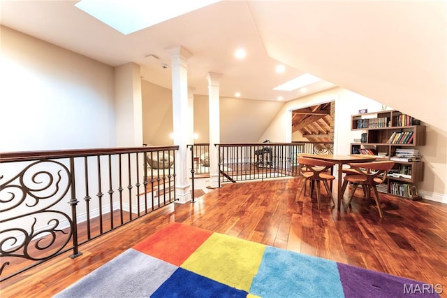 16 Holiday Ln, Saint Louis, MO 63131 - bonus room featuring wood-type flooring, ornate columns, a skylight, recessed lighting, and lofted ceiling