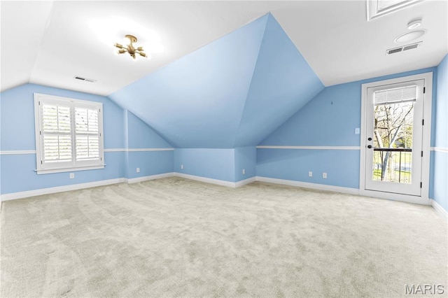 16 Holiday Ln, Saint Louis, MO 63131 - additional living space with vaulted ceiling, carpet floors, and baseboards