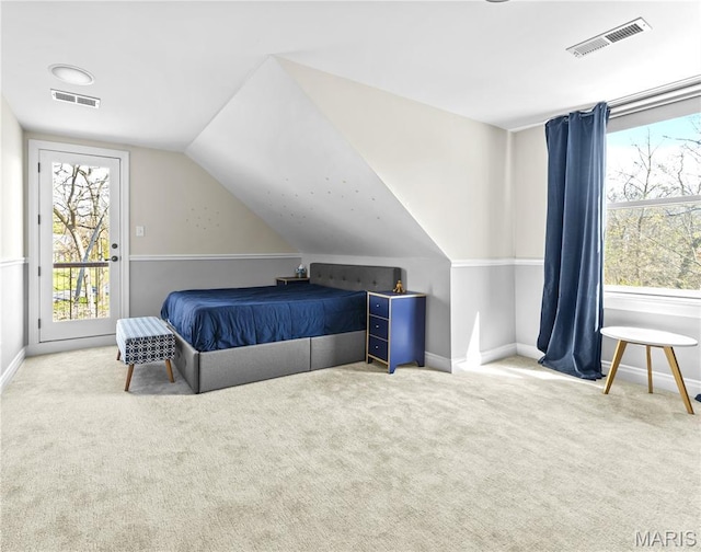 16 Holiday Ln, Saint Louis, MO 63131 - bedroom with carpet flooring, vaulted ceiling, baseboards, and access to exterior