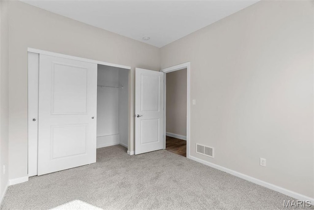 891 Walter Way, Washington, MO 63090 - unfurnished bedroom featuring carpet floors, a closet, and baseboards