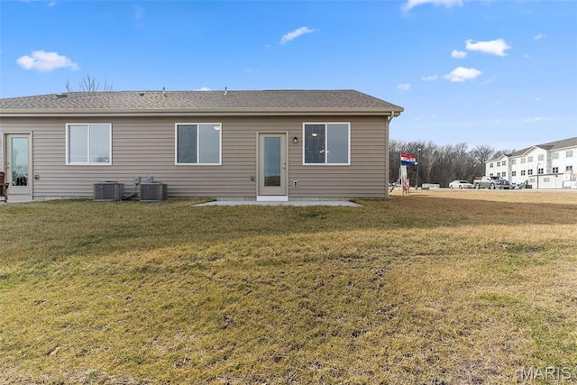 891 Walter Way, Washington, MO 63090 - back of house featuring a yard, central air condition unit, and a shingled roof