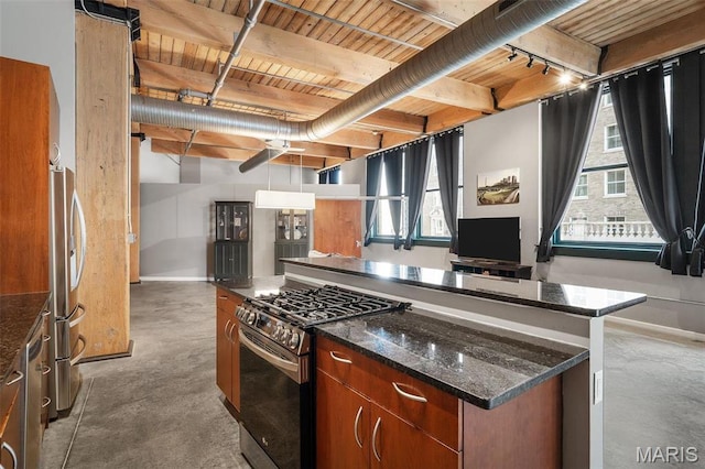 901 Washington Ave Unit 304, Saint Louis, MO 63101 - kitchen featuring appliances with stainless steel finishes, concrete flooring, healthy amount of natural light, a center island, and a wood ceiling with exposed beams