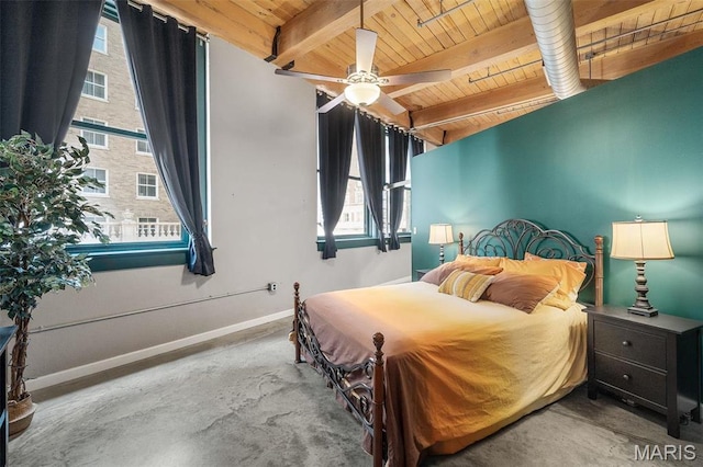 901 Washington Ave Unit 304, Saint Louis, MO 63101 - bedroom featuring a wood ceiling with exposed beams, concrete floors, and a ceiling fan