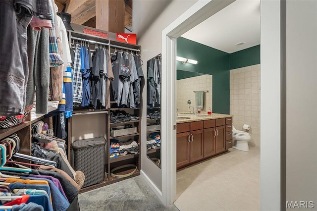 901 Washington Ave Unit 304, Saint Louis, MO 63101 - walk in closet with light tile patterned flooring and a sink