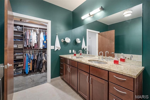 901 Washington Ave Unit 304, Saint Louis, MO 63101 - full bath featuring double vanity, tile patterned floors, and a walk in closet