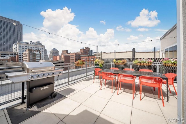 901 Washington Ave Unit 304, Saint Louis, MO 63101 - view of patio / terrace with a grill, a view of city, and outdoor dining area