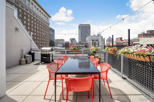 901 Washington Ave Unit 304, Saint Louis, MO 63101 - view of patio with a skyline view, area for grilling, and outdoor dining space