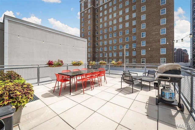 901 Washington Ave Unit 304, Saint Louis, MO 63101 - view of patio featuring grilling area and outdoor dining area