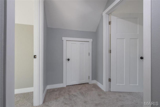 120 E Charles St, St James, MO 65559 - hallway featuring carpet flooring and vaulted ceiling