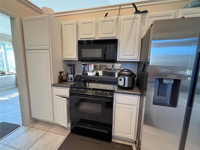 809 Cambridge Dr, Rolla, MO 65401 - kitchen featuring black appliances, dark countertops, white cabinetry, and light tile patterned floors