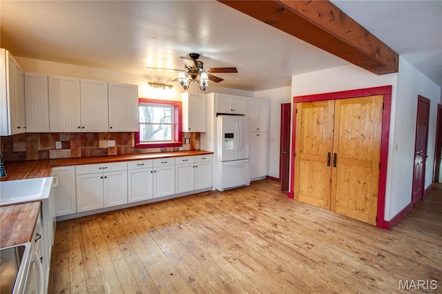 40 Country Ln, Wood River, IL 62095 - kitchen with white fridge with ice dispenser, wooden counters, a ceiling fan, light wood finished floors, and white cabinetry