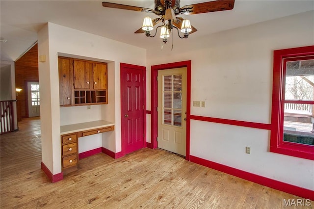 40 Country Ln, Wood River, IL 62095 - entryway with built in desk, ceiling fan, healthy amount of natural light, and light wood-style flooring