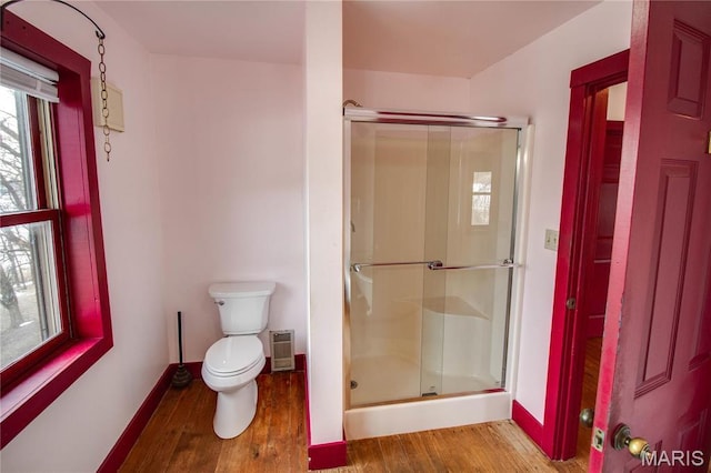 40 Country Ln, Wood River, IL 62095 - bathroom featuring wood finished floors, a shower stall, toilet, and baseboards