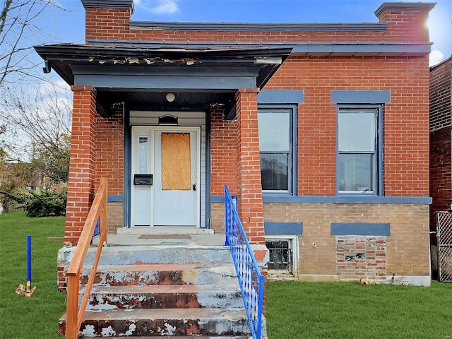 1636 Belt Ave, Saint Louis, MO 63112 - entrance to property with brick siding, a yard, and a chimney