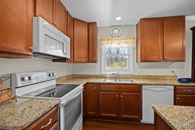10949 Clearwater Ln, Plainview, IL 62685 - kitchen featuring white appliances, a sink, light stone counters, dark wood-style floors, and brown cabinets