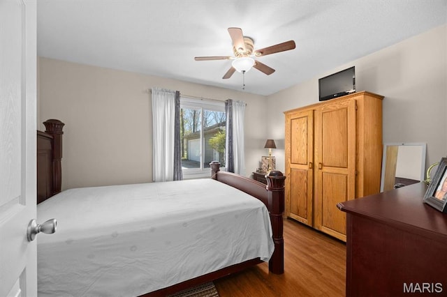 10949 Clearwater Ln, Plainview, IL 62685 - bedroom with dark wood-style floors and a ceiling fan