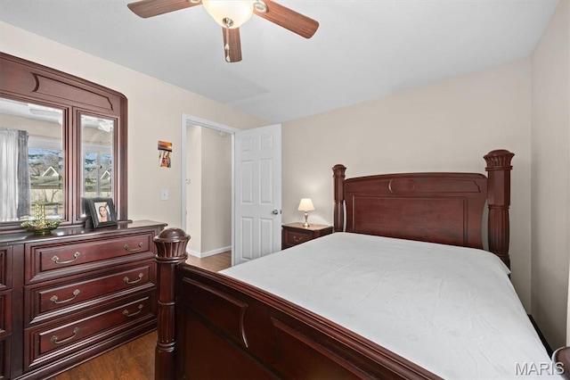 10949 Clearwater Ln, Plainview, IL 62685 - bedroom with dark wood-type flooring, a ceiling fan, and baseboards