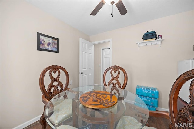 10949 Clearwater Ln, Plainview, IL 62685 - dining area featuring baseboards, ceiling fan, and wood finished floors