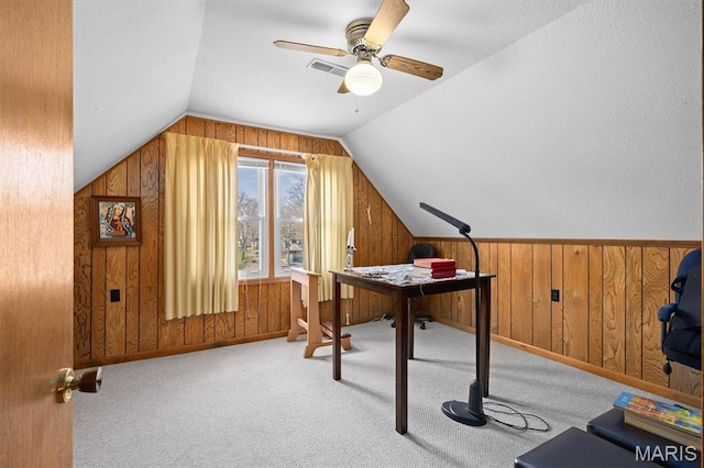 10949 Clearwater Ln, Plainview, IL 62685 - carpeted home office featuring wooden walls, lofted ceiling, and ceiling fan
