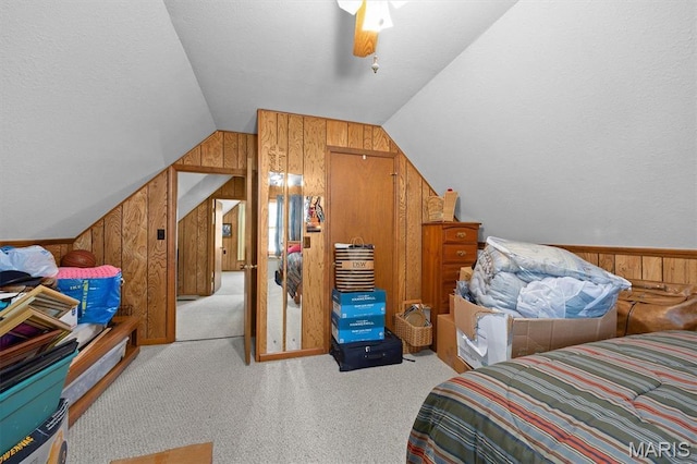 10949 Clearwater Ln, Plainview, IL 62685 - bedroom featuring wood walls, vaulted ceiling, carpet floors, and ceiling fan