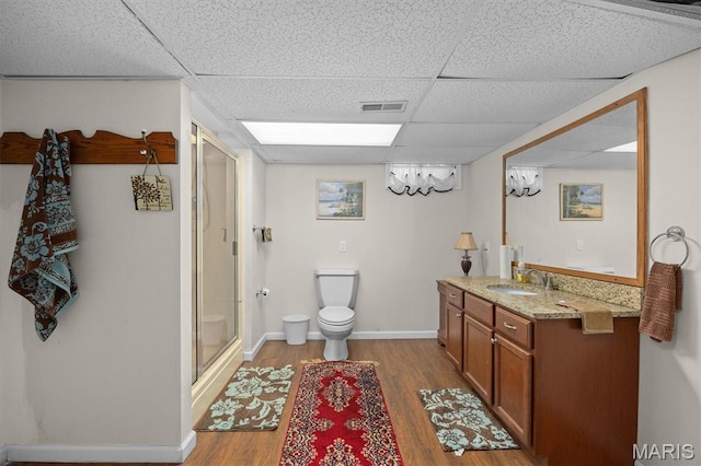 10949 Clearwater Ln, Plainview, IL 62685 - full bath with a drop ceiling, wood finished floors, a shower stall, toilet, and vanity