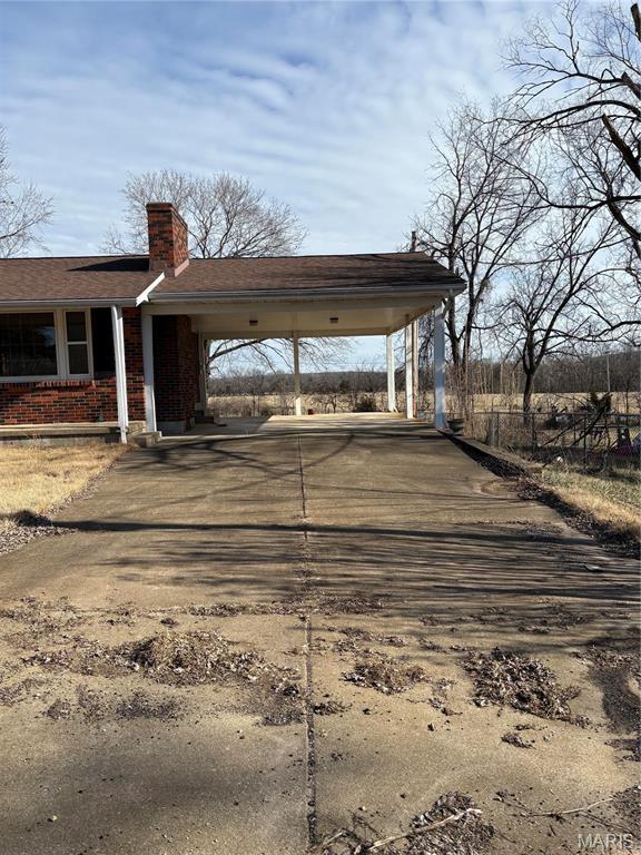 10019 Seabourne St, Belgrade, MO 63622 - view of parking / parking lot with driveway and an attached carport