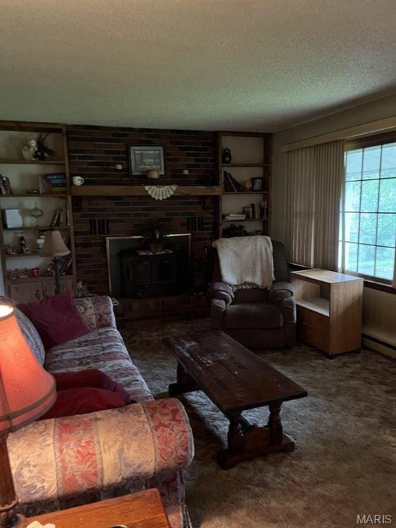 10019 Seabourne St, Belgrade, MO 63622 - living area featuring a textured ceiling, a fireplace, carpet flooring, and baseboard heating