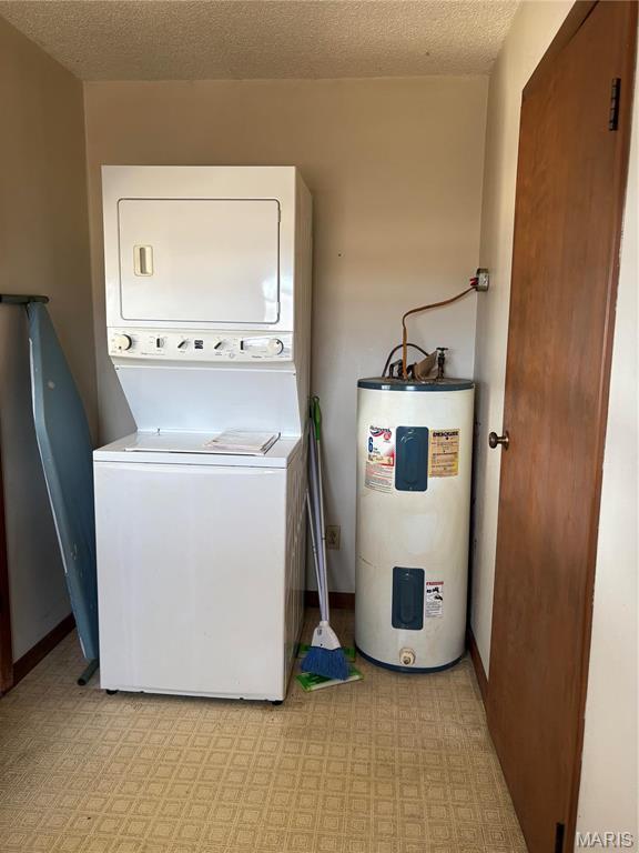 10019 Seabourne St, Belgrade, MO 63622 - laundry area with water heater, estacked washer and dryer, a textured ceiling, and light flooring